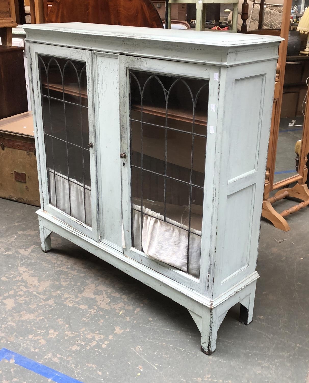 A light blue painted lead glazed bookcase, glass af, 122x34x122cmH