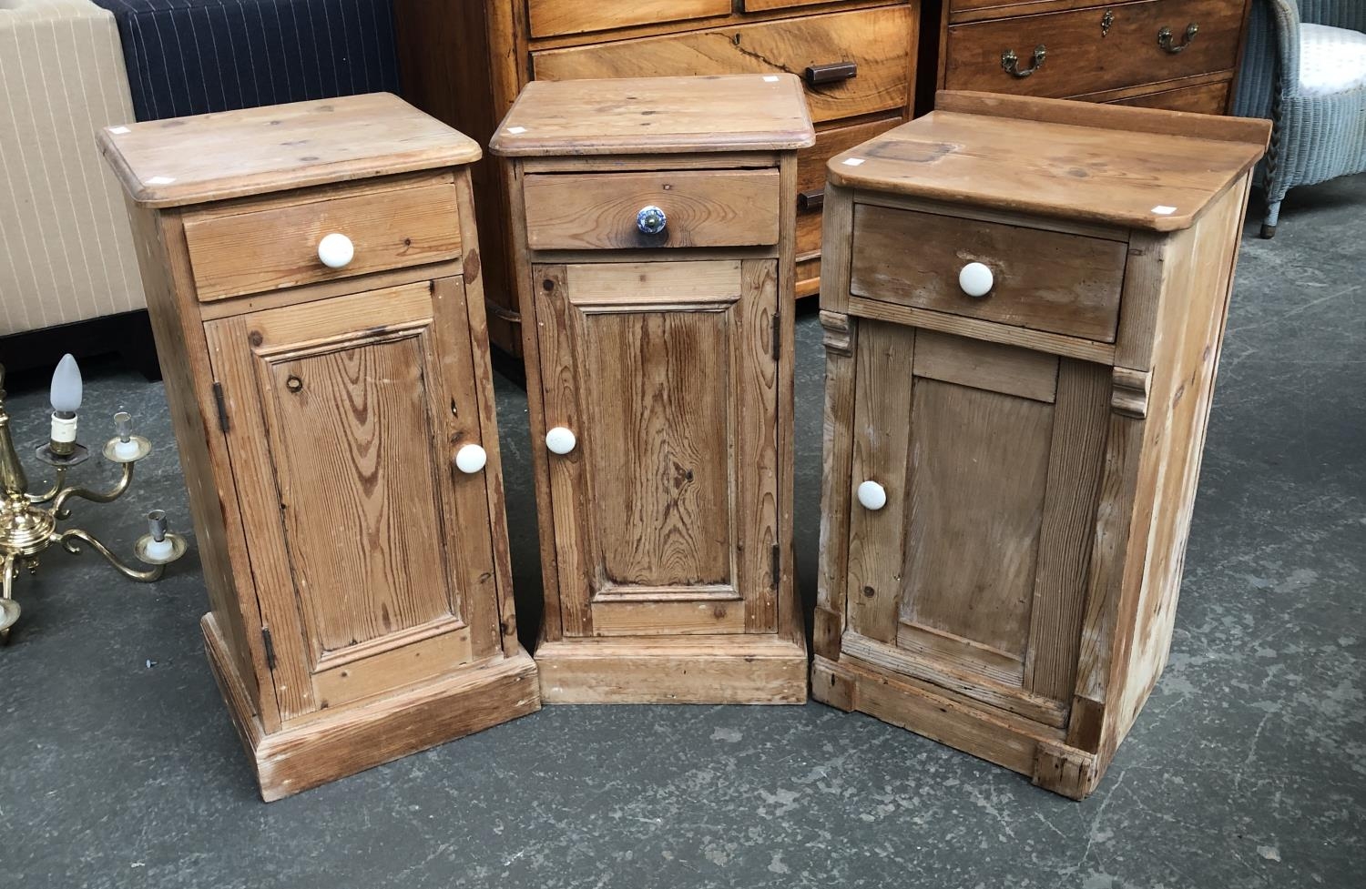 A pair of pine bedside cabinets, each with single drawer over a panelled cupboard, 34x30x71cm;