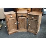 A pair of pine bedside cabinets, each with single drawer over a panelled cupboard, 34x30x71cm;