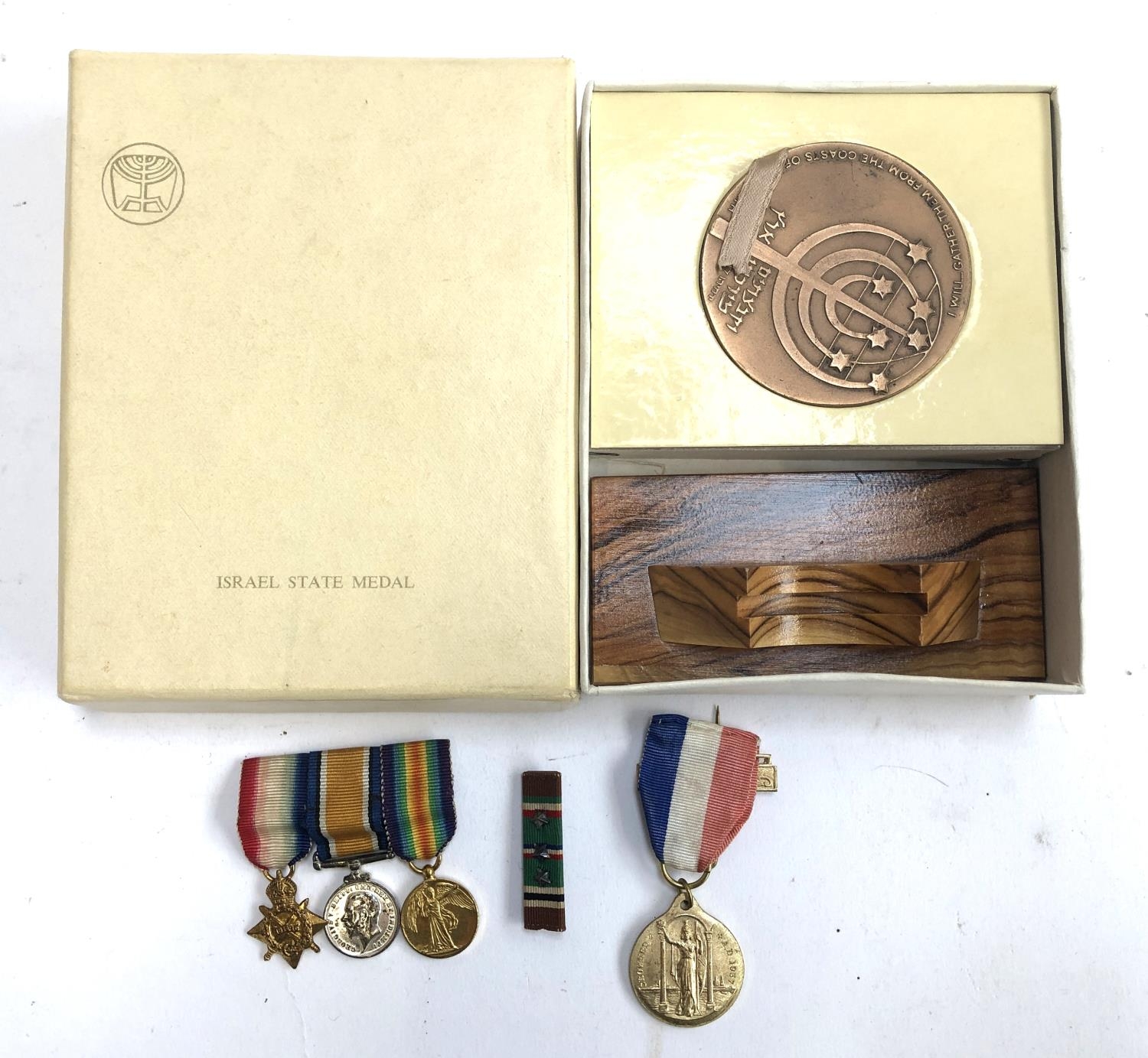 A set of 3 miniature medals comprising 1914-15 star, victory and war medals, together with an Edward