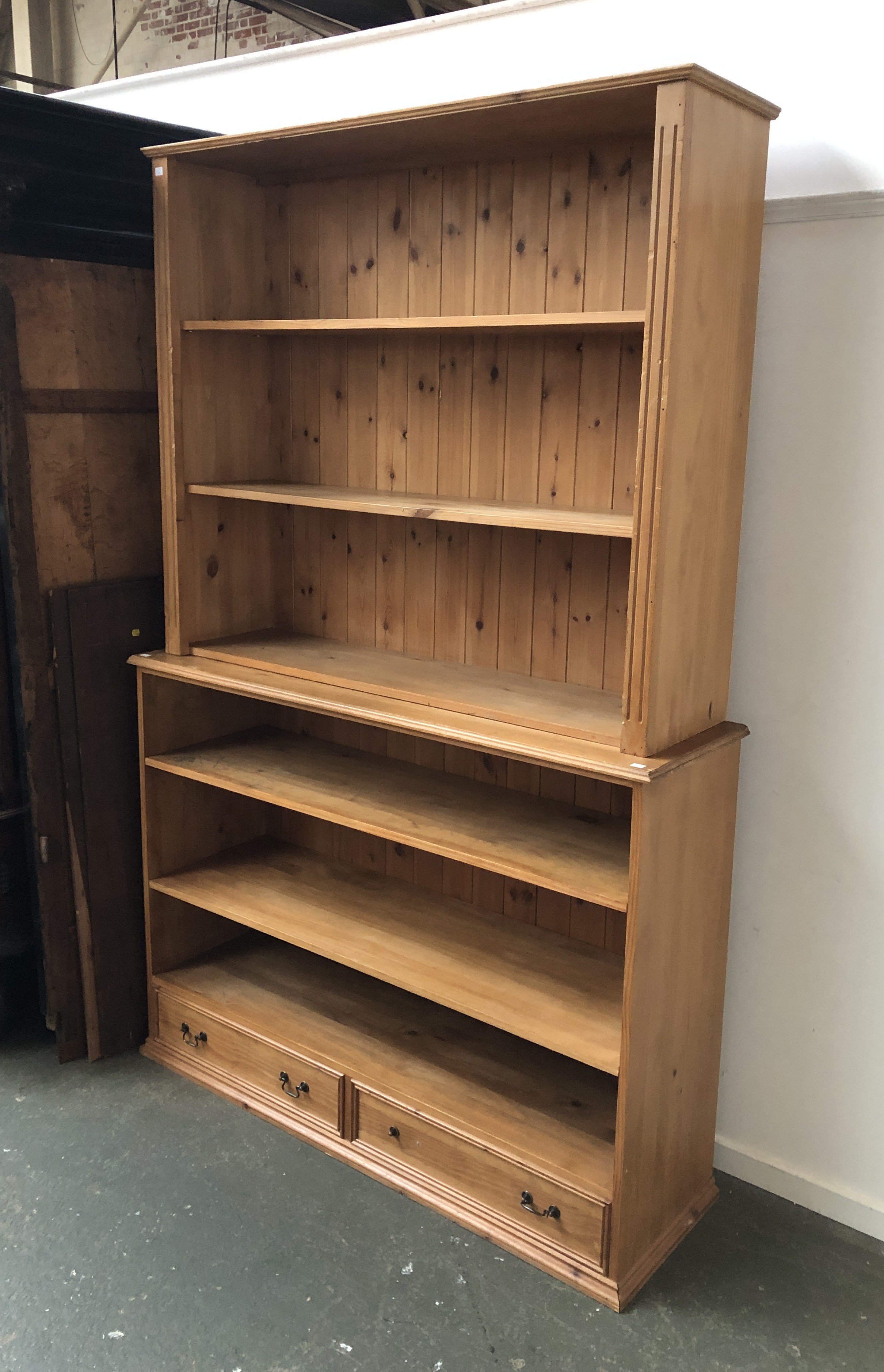 Two pine bookcases, 130x33x112cmH and 140x41x103cmH (2)