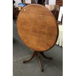 An early 20th century oak tip top tripod table, on four swept legs, 92x72cmH