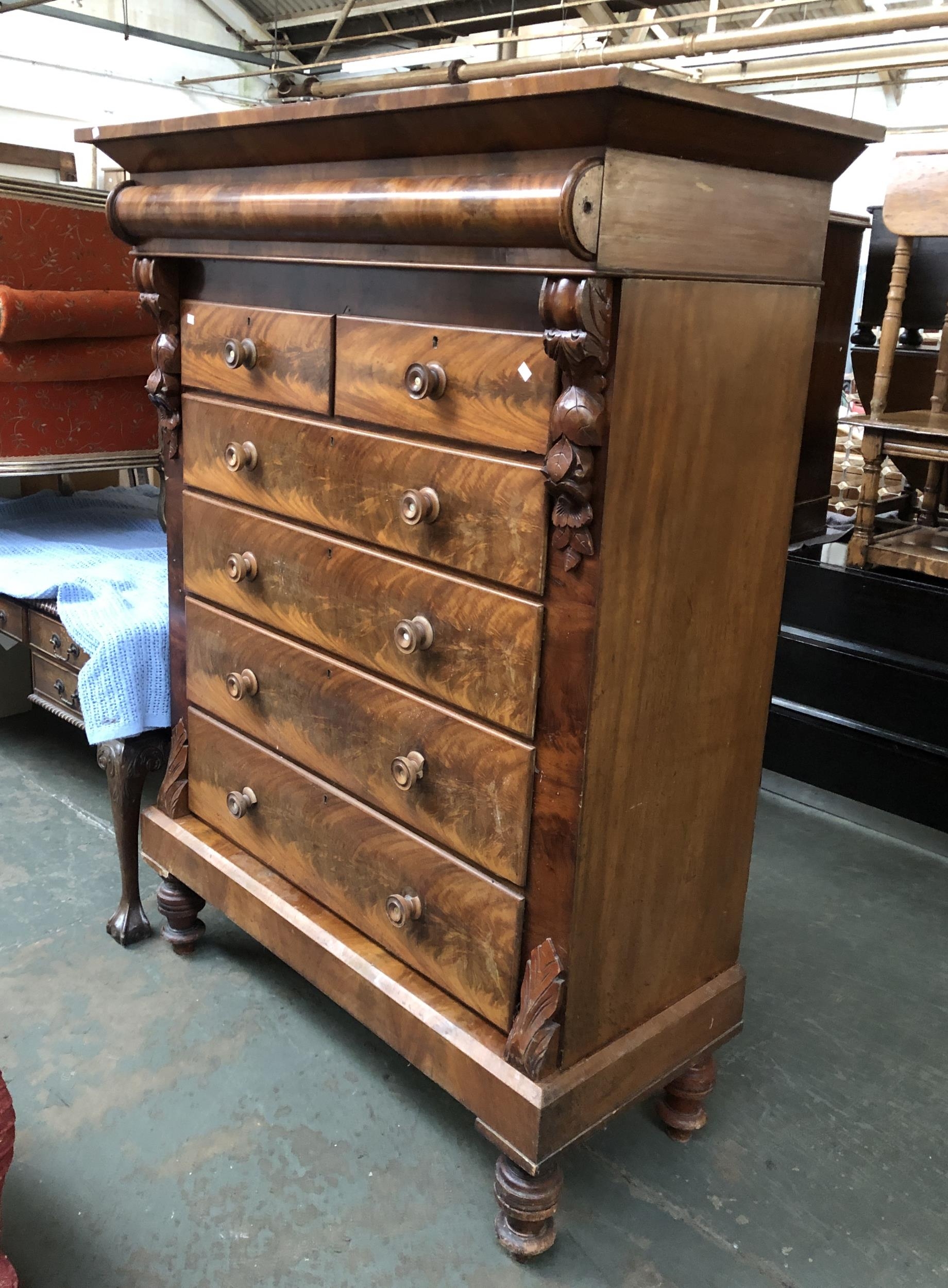 A very large Scottish mahogany chest of drawers, comprising two short over four long drawers,