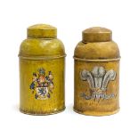 A pair of toleware canisters, both crested, one with fleur de lis and 'By Appointment', the other