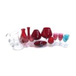 A mixed lot of mainly cranberry glass to include small wine glasses, vases, handblown jug, brandy