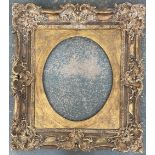 A large 19th century carved gilt gesso picture frame with later oval inset, 90x100cm