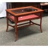 A small 20th century mahogany bijouterie table with bevelled glass top, 60x39x46cmH