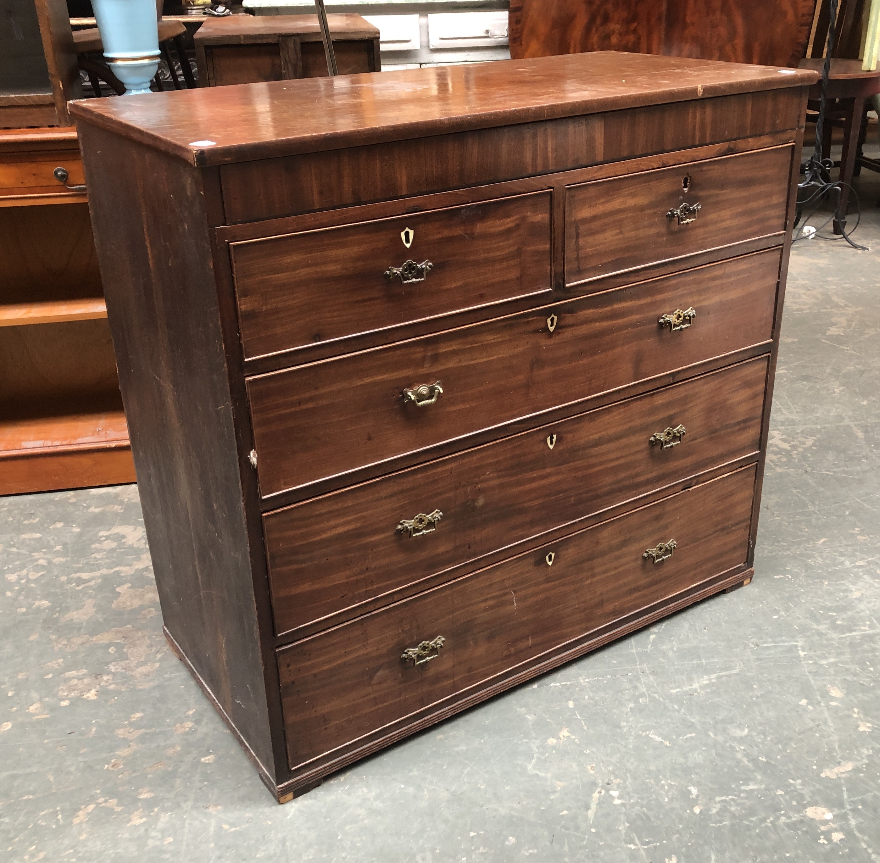 A 19th century mahogany chest of drawers, two short over three long drawers (feet missing),