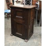 A 17th century and later oak cabinet of two panelled doors, 70x50x97cmH