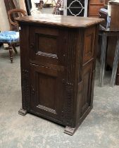 A 17th century and later oak cabinet of two panelled doors, 70x50x97cmH