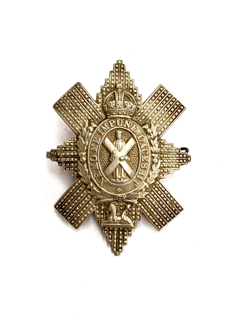 Scottish military interest: A Black Watch Royal Highlanders cap badge, bearing motto 'Nemo Me Impune