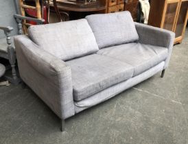 A contemporary grey two seater sofa on chromed steel frame, 168cm wide 90cm deep