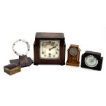 An Art Deco style mantel clock; a smaller bakelite mantel clock; a small oak and marquetry mantel