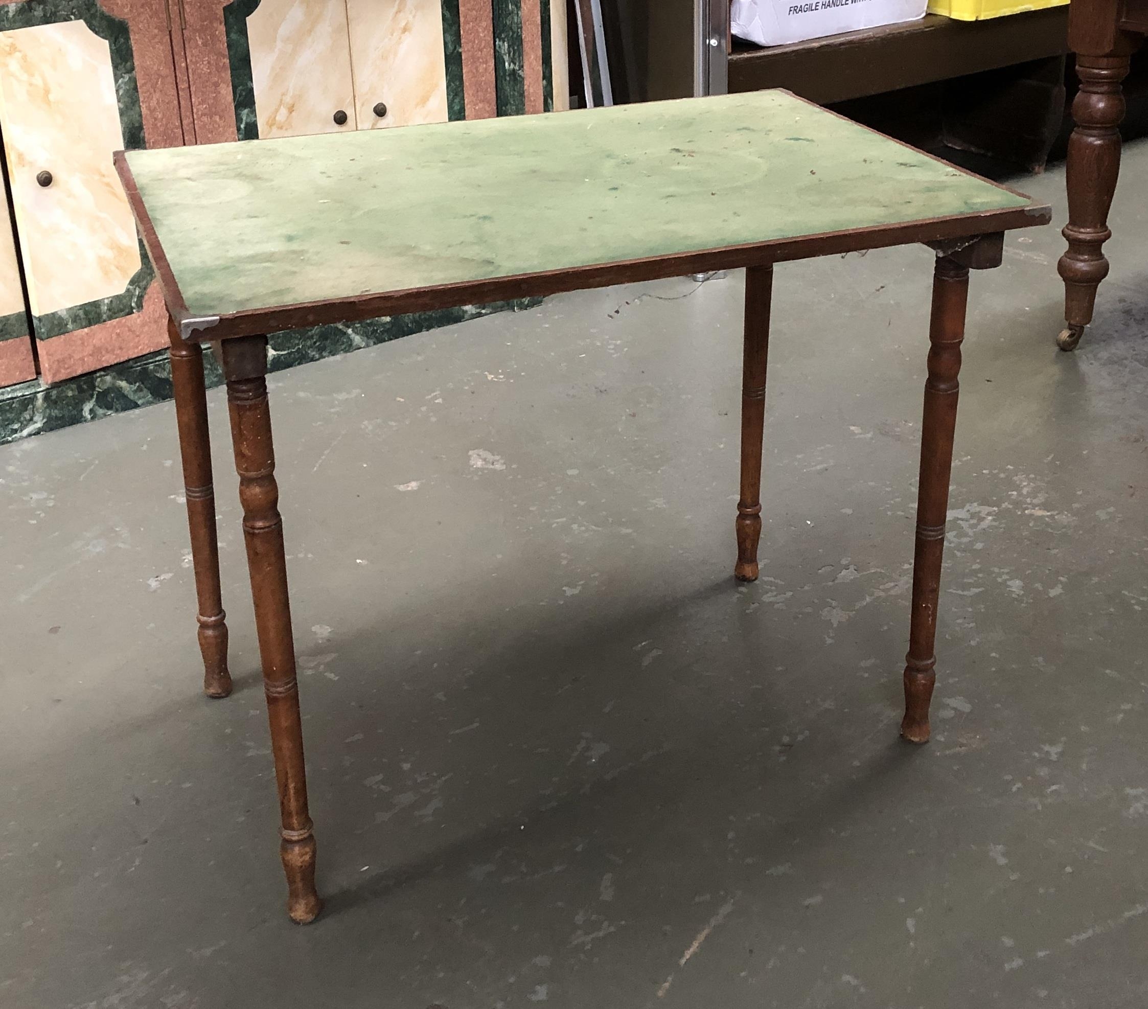 A folding rectangular card table with green baize top, 84x61cm