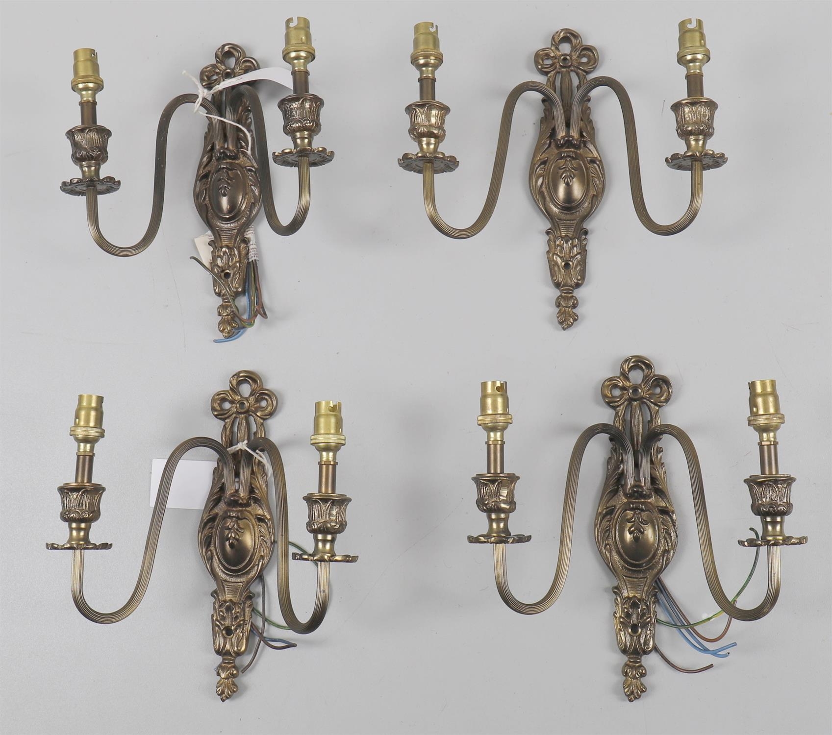 A set of four gilt metal twin light wall appliques, in the 18th century French style, 20th