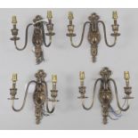 A set of four gilt metal twin light wall appliques, in the 18th century French style, 20th