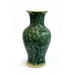 A large green glazed pottery vase, 52cmH