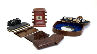 An early 20th century desk calendar; leather wallets; Manon binoculars; vanity set (af)