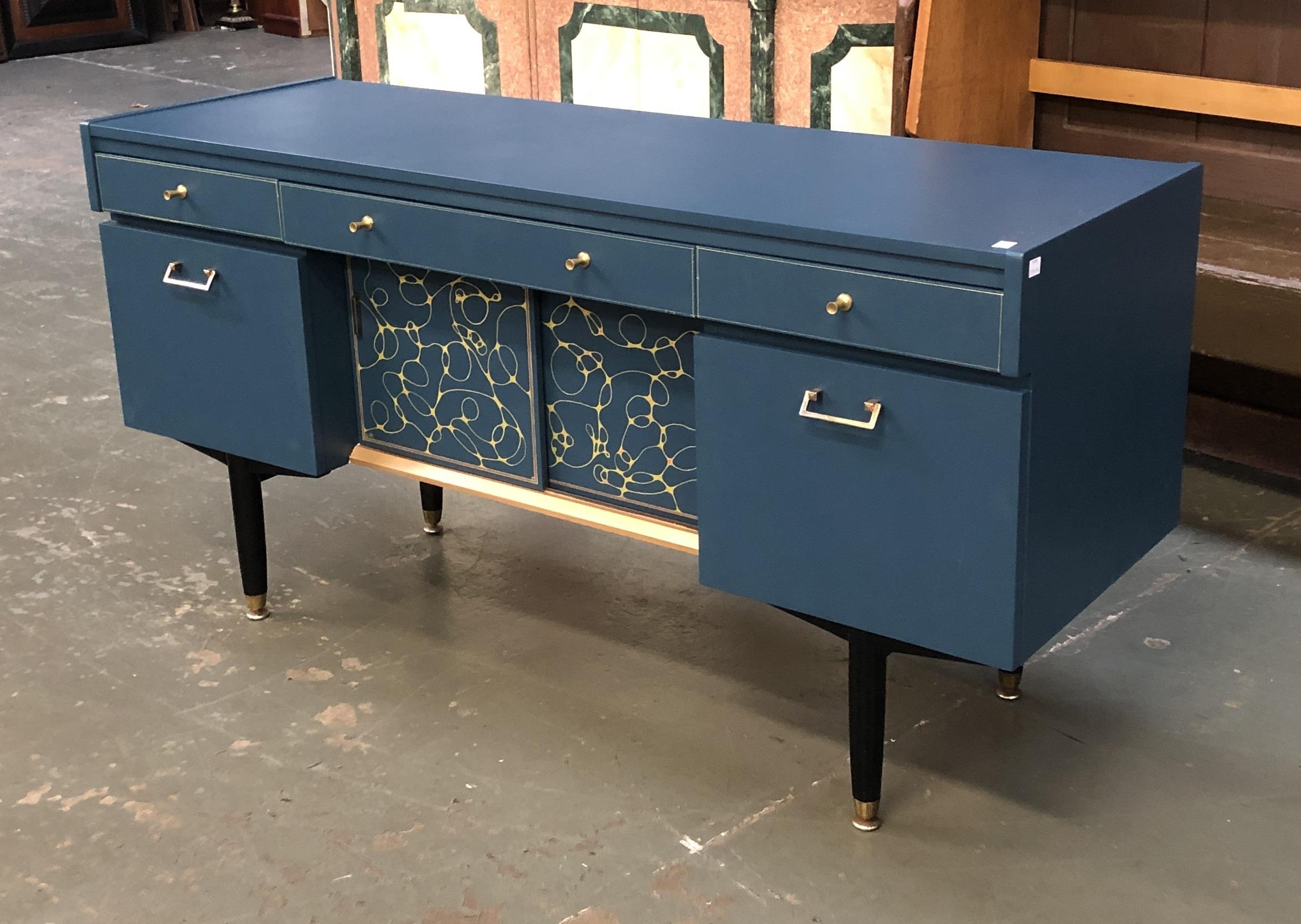 Interior design interest: A mid century Nathan sideboard, painted in a dark blue with gilt