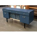 Interior design interest: A mid century Nathan sideboard, painted in a dark blue with gilt