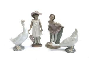 Four Nao by Lladro figures, comprising two white geese, girl with umbrella, no. 1126, and ballerina,