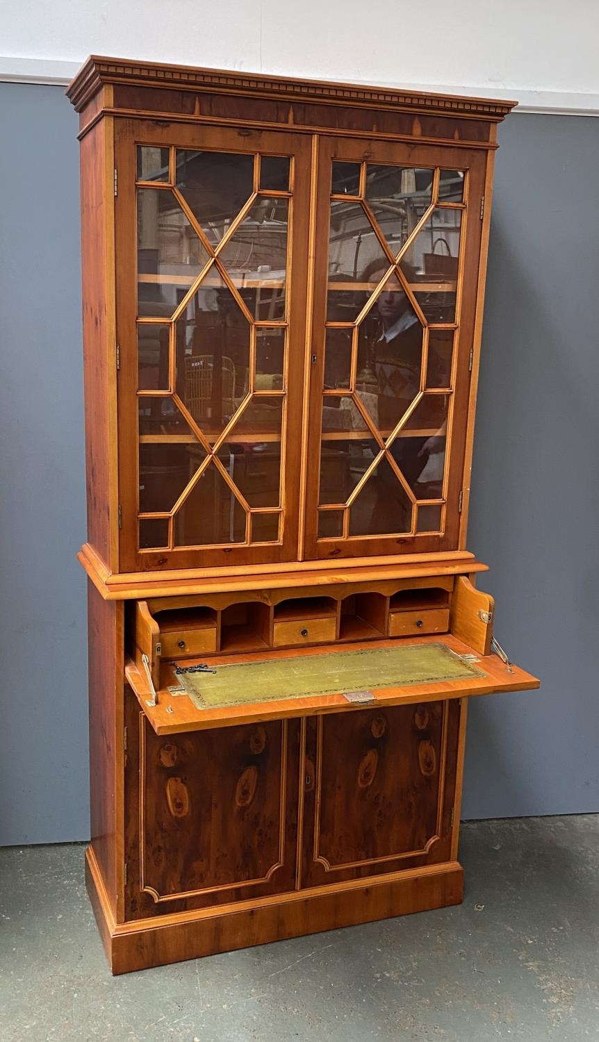 A 20th century yew veneer glazed bookcase, with single drawer and cupboards below, 95x39x200cmH - Image 2 of 2