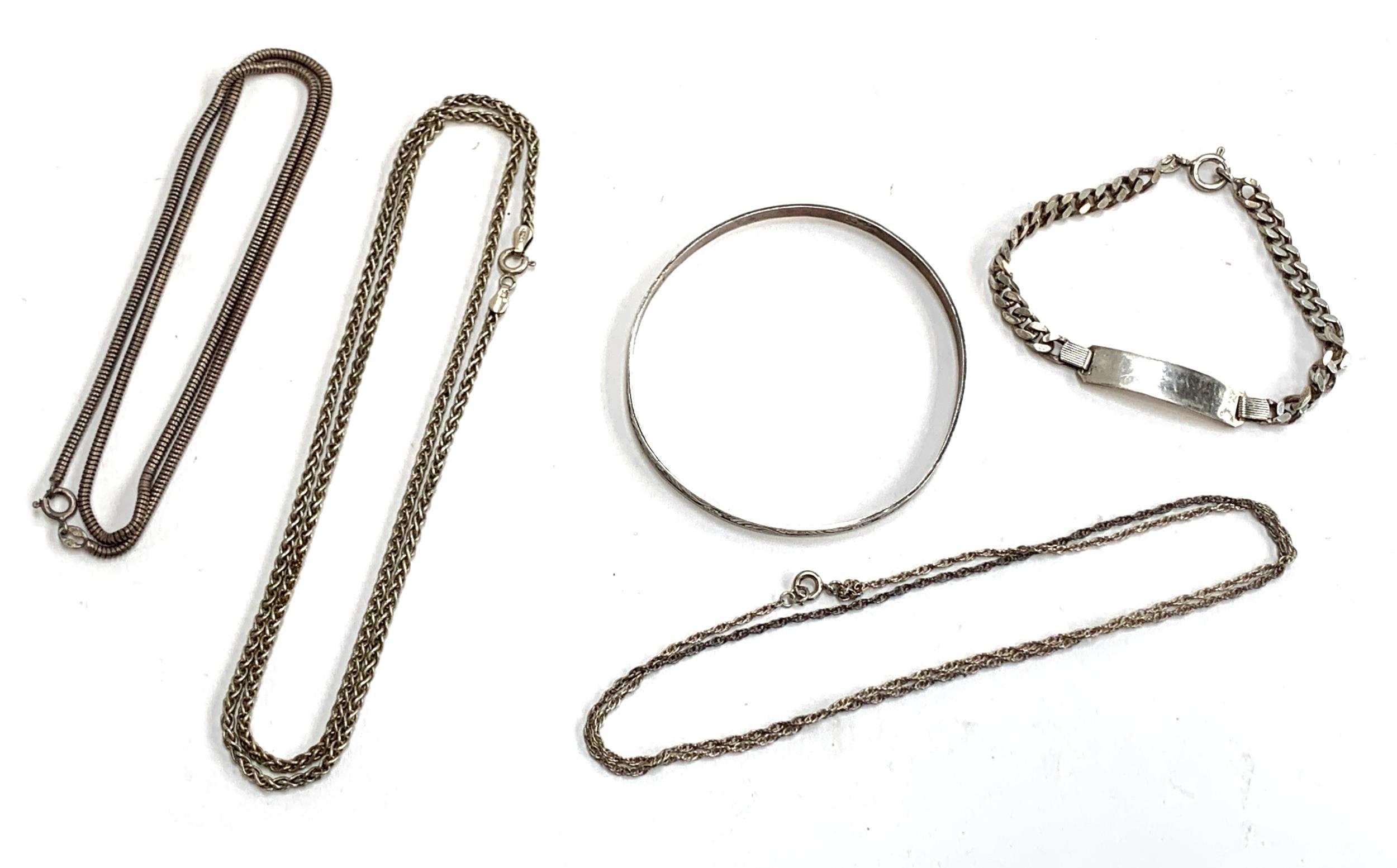 A quantity of silver chains, bangle and a bracelet, gross weight 42g