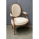 A carved and upholstered open armchair in Louis XV taste, 59cmW