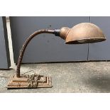 A vintage industrial opposable lamp