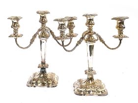 A pair of Viners silver plated three arm candlesticks, 34cmH