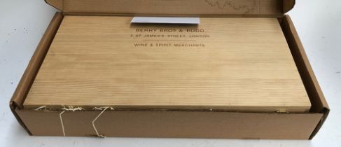 A Berry Bros & Rudd wooden wine box with 6 dividers, with rope loop side handles, 68x36x13cmH