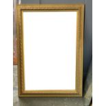 A large gilt framed rectangular mirror with bevelled glass, 107x76cm