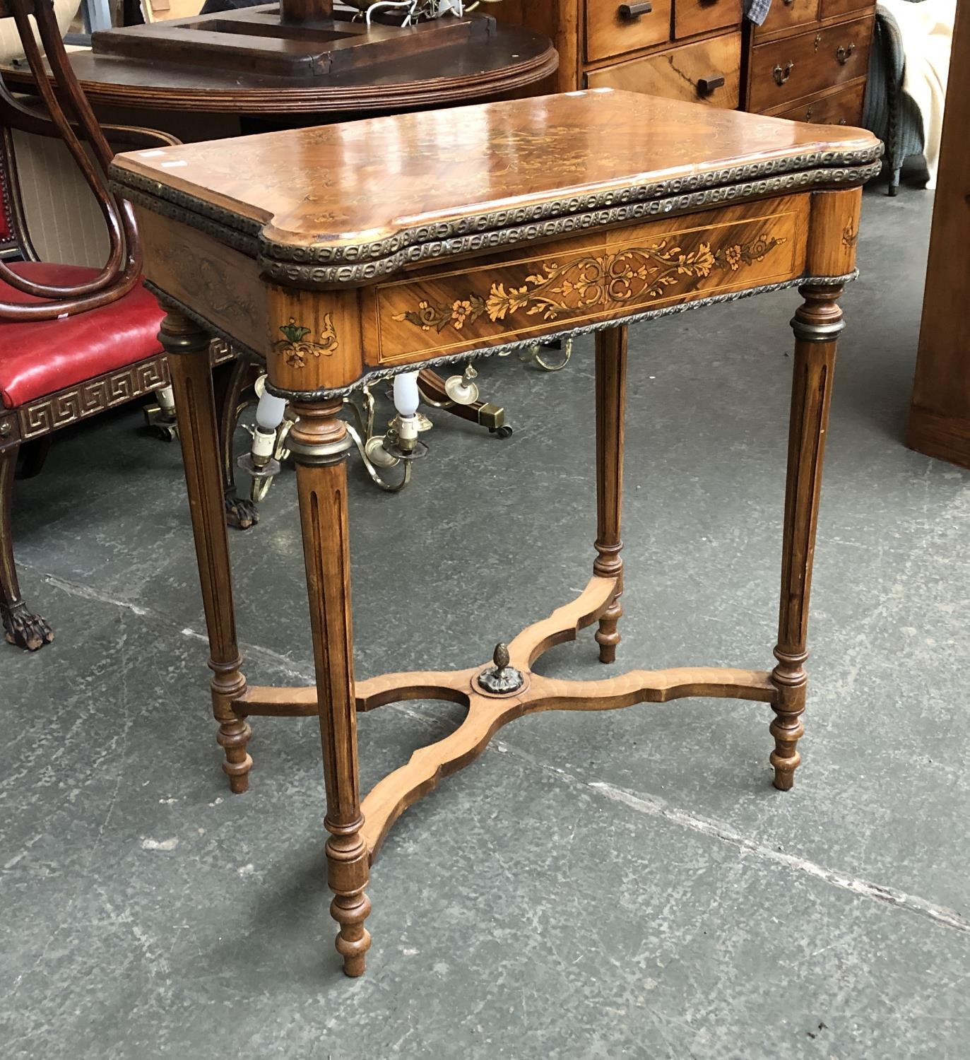 A Dutch tulip wood and pen work card table, with gilt metal mounts, on fluted tapering legs,