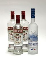 Two bottles of Smirnoff No.21 (100cl, 37.5%), together with a further bottle (70cl, 37.5%), and Grey