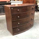 A 19th century bowfront mahogany chest of four graduating drawers (feet missing), 114x56x101cmH