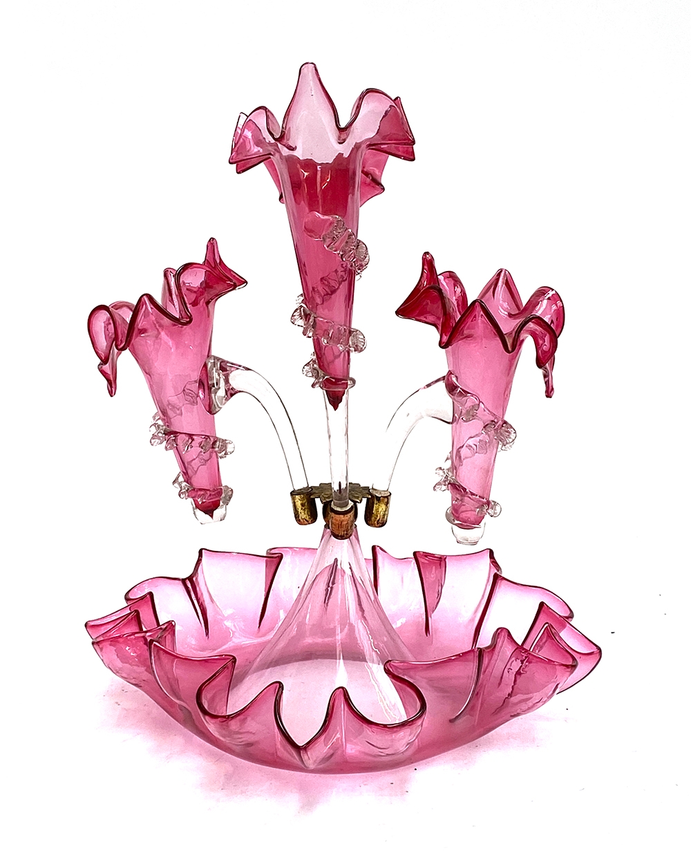 A cranberry glass epergne centrepiece, with three stemmed vases, the fourth missing, 35cm high