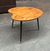 A mid century artists palette shaped coffee table, with marquetry inlaid top, on dansette legs,