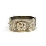 A Victorian Aesthetic Movement silver bangle, hallmarked for Birmingham, 1886, 27g