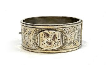 A Victorian Aesthetic Movement silver bangle, hallmarked for Birmingham, 1886, 27g