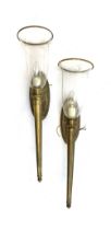 A pair of brass wall sconces with bell shaped glass shades, with oval backplates, each 57cmH