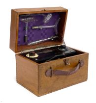 A Violet Ray Vitalator no. 3922, bakelite with four glass attachments, in a wooden case, 26cmW