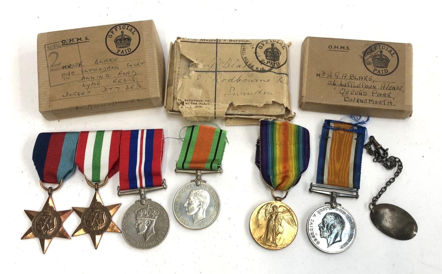 A WWI victory and war medal pair inscribed Pte. W. G. Blake. Tank Corps, together with a trio of