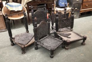 Five North Indian/Afghan hardwood and woven hide low Pidah wedding chairs, purchased from Joss