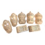 Interior design interest: seven Moroccan style terracotta pierced wall candle holders/sconces,