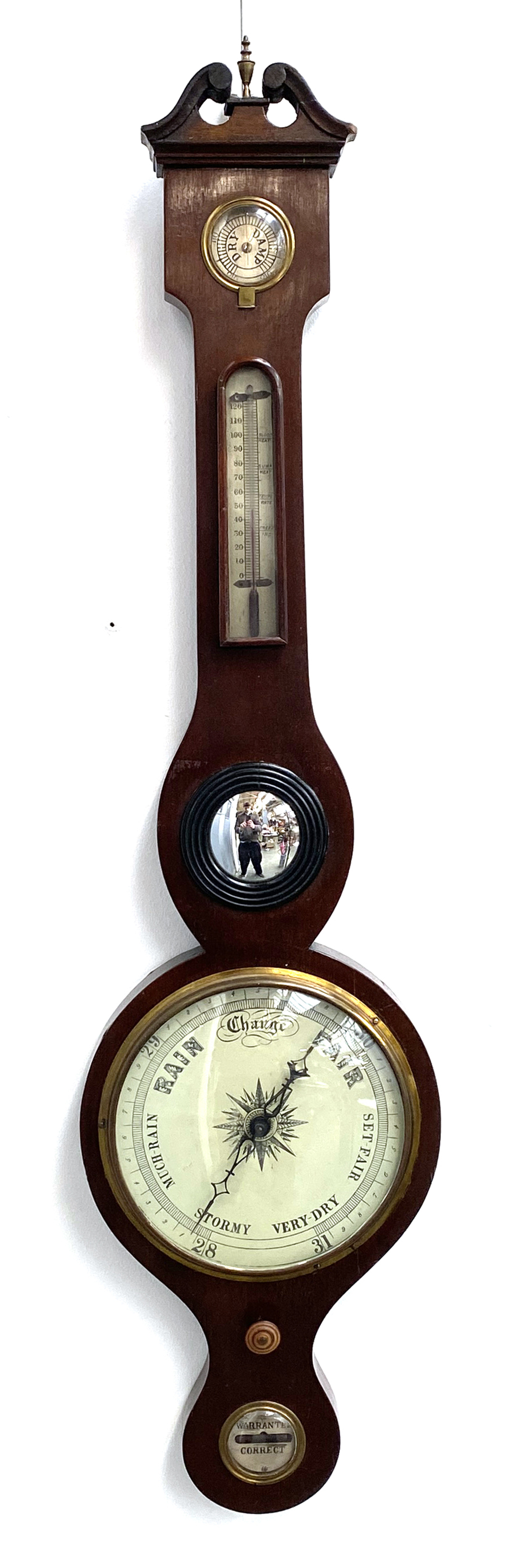 A mahogany banjo barometer with central small mirror and reeded ebonised slip, 99cmH