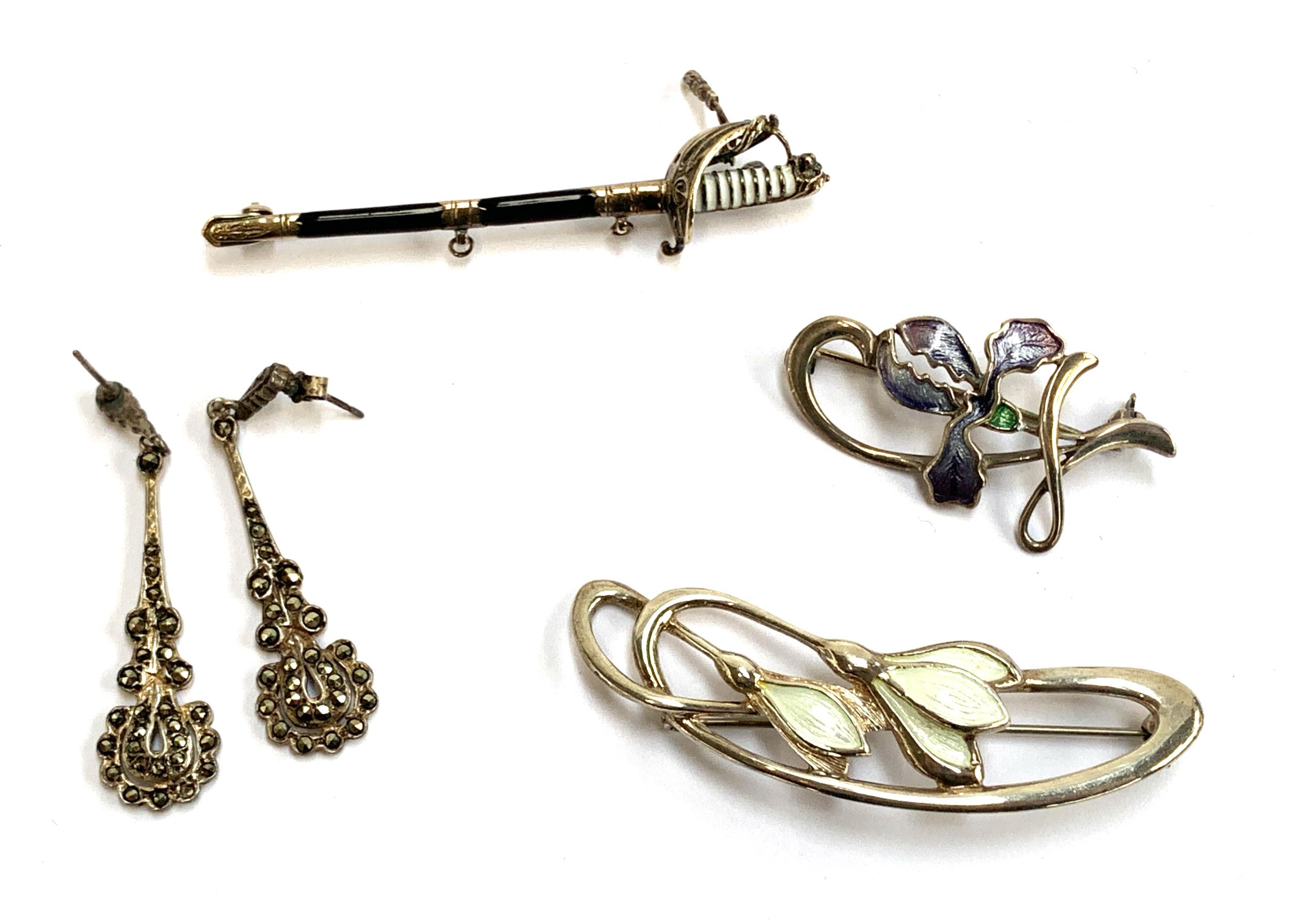 An silver and enamel regimental ceremonial sword brooch; a pair of silver and marcasite earrings;