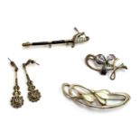 An silver and enamel regimental ceremonial sword brooch; a pair of silver and marcasite earrings;