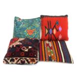 Four cushions to include two kilim covered and one carpet covered