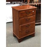 A bedside cabinet of four drawers, on bracket feet, 46x32x74cmH