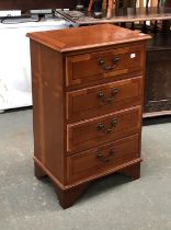 A bedside cabinet of four drawers, on bracket feet, 46x32x74cmH